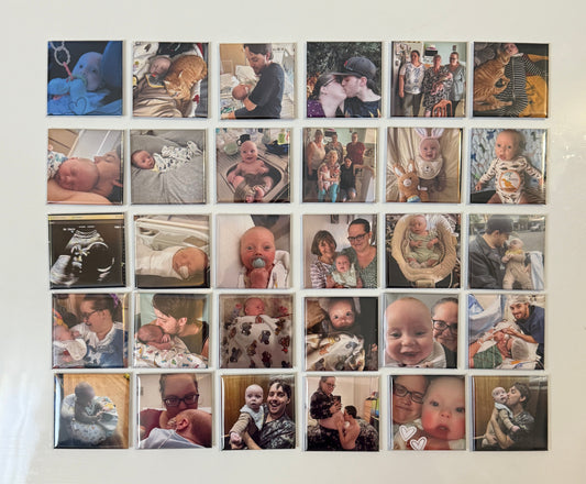 Grid of photo magnets on a wall with a wooden frame.