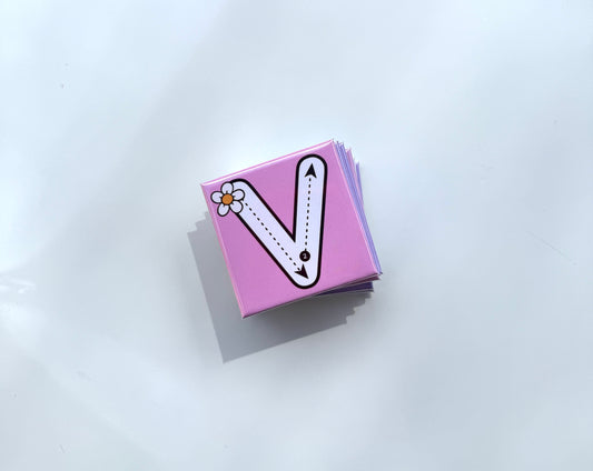 Pink card with letter 'V' design on a white background