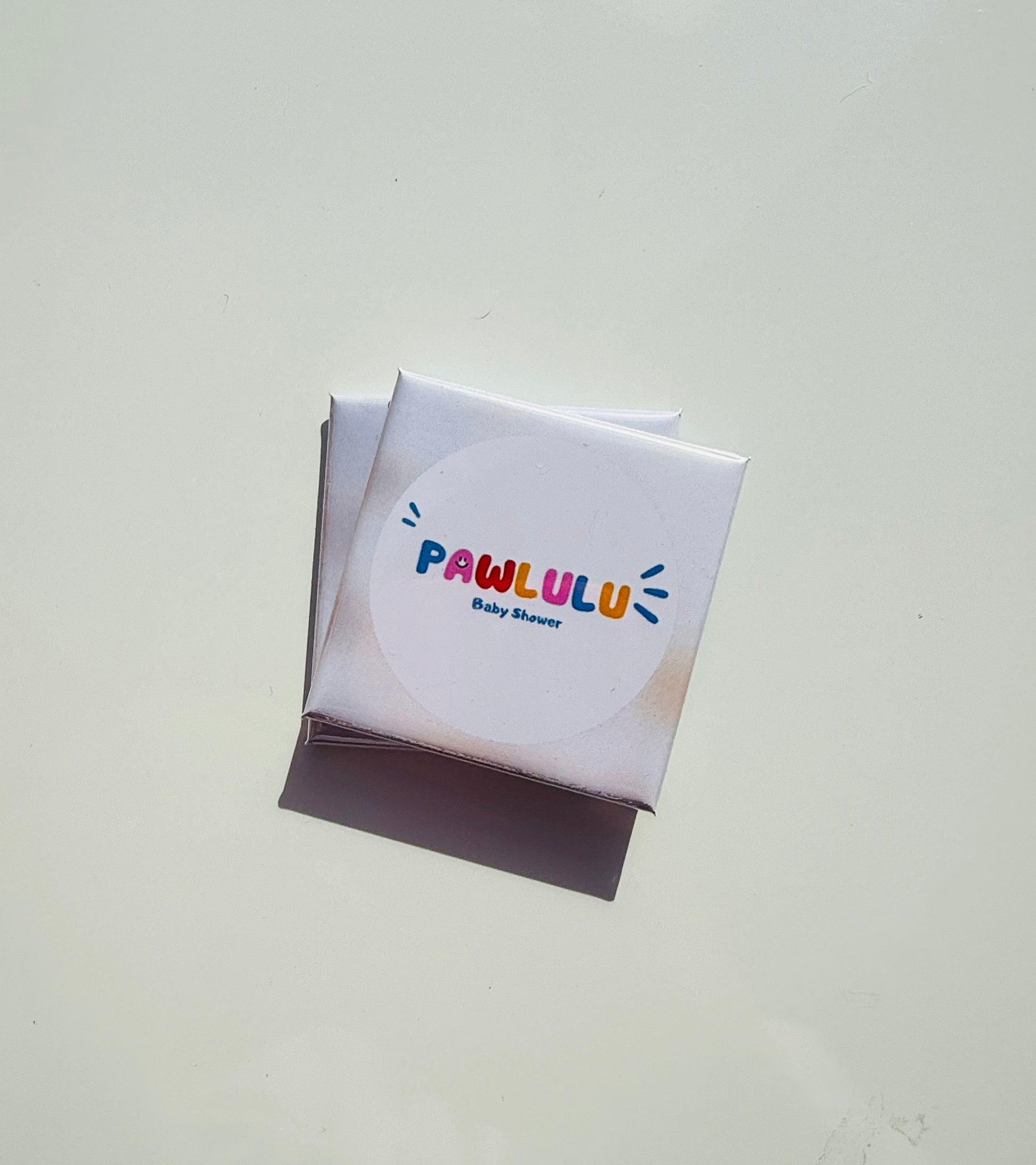 Custom photo magnet packaging featuring PAWLULU Baby Shower event label on a white background